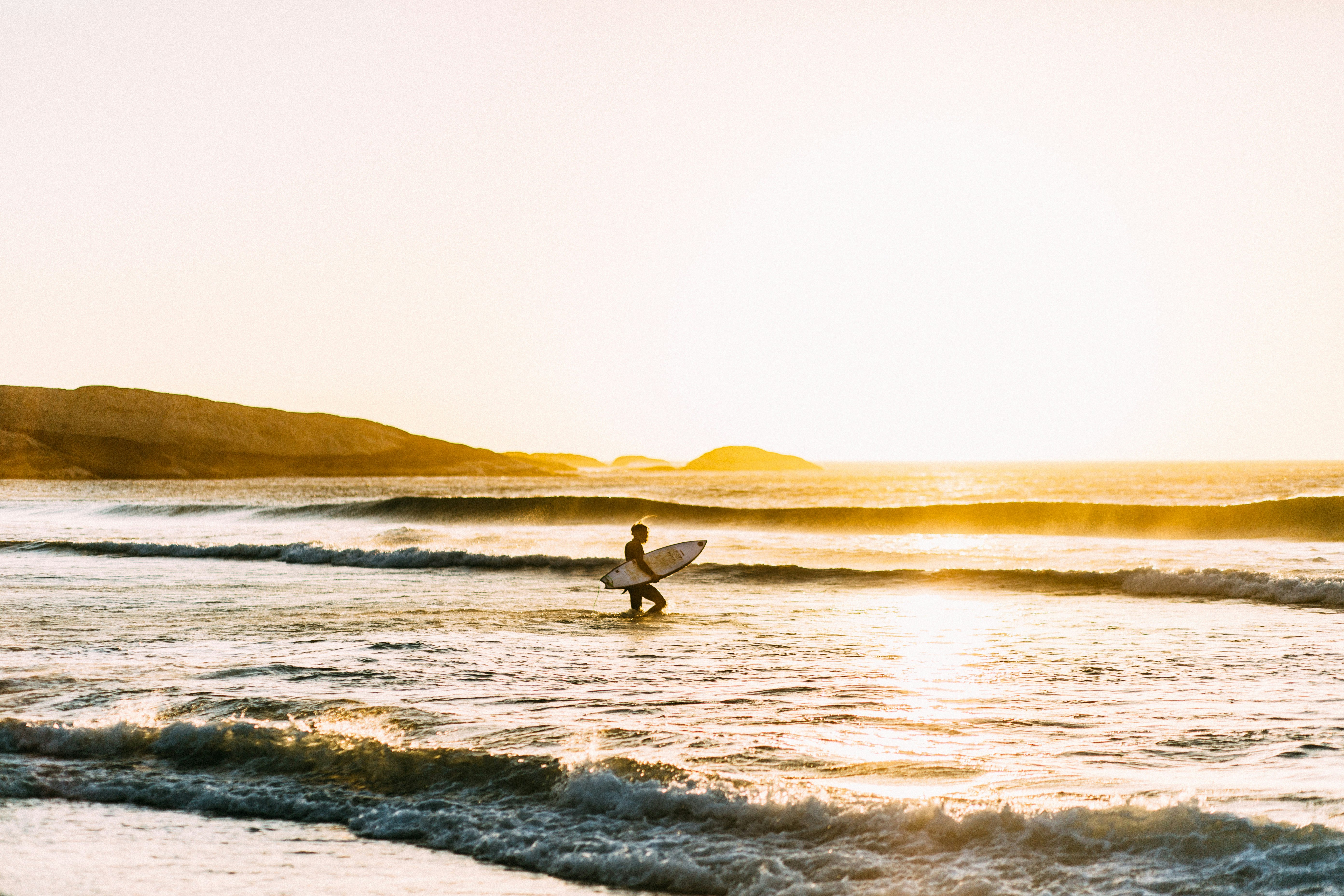 man holding his surfboard